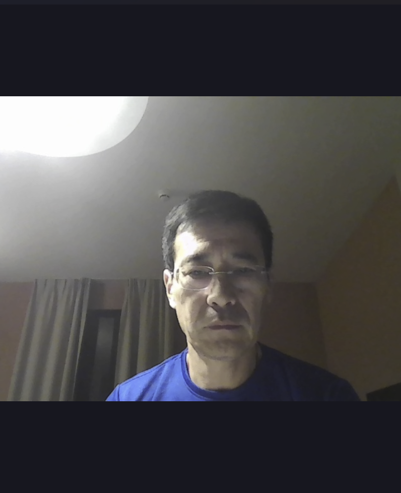 Before: webcam selfie with glasses and cluttered background